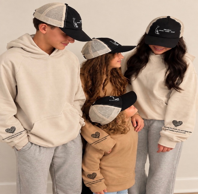 Family wearing Olivija's Hands hoodies and caps